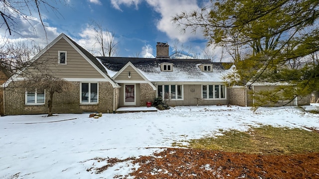 view of snow covered house