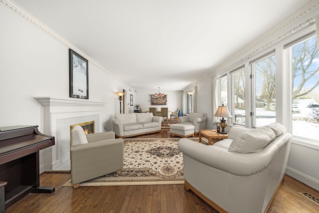 living room with ornamental molding and hardwood / wood-style flooring