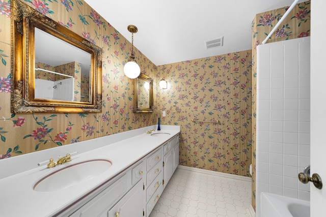 bathroom featuring tile patterned floors, vanity, and shower / tub combination