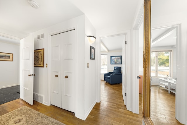 hallway with hardwood / wood-style floors