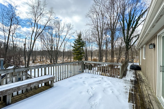 view of snow covered deck