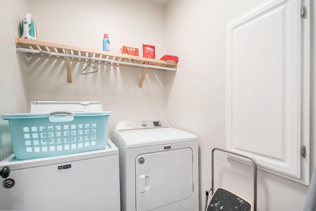 washroom featuring independent washer and dryer