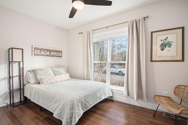 bedroom with dark wood-type flooring and ceiling fan