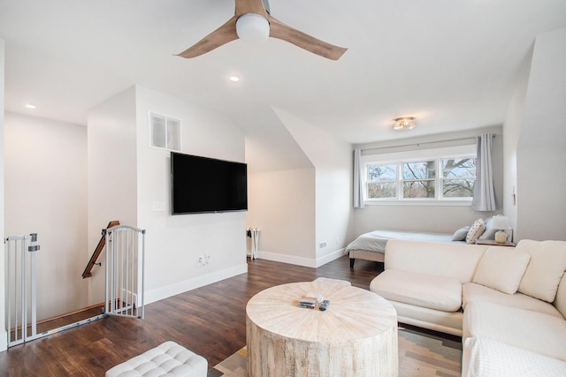 living room with dark hardwood / wood-style floors and ceiling fan