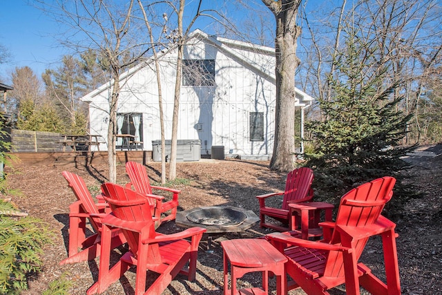 view of yard featuring a fire pit and central air condition unit