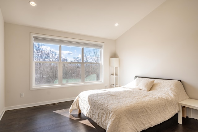 bedroom featuring recessed lighting, vaulted ceiling, baseboards, and wood finished floors