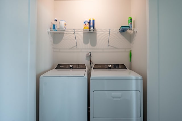 laundry area featuring laundry area and washing machine and dryer