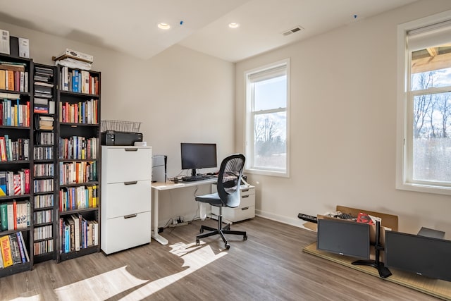 office area featuring visible vents, wood finished floors, a wealth of natural light, and recessed lighting