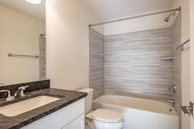 bathroom with vanity, bathtub / shower combination, and toilet