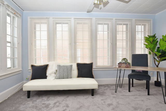 sunroom with ceiling fan and plenty of natural light