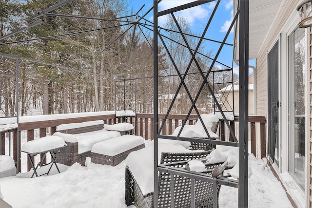 view of snow covered deck