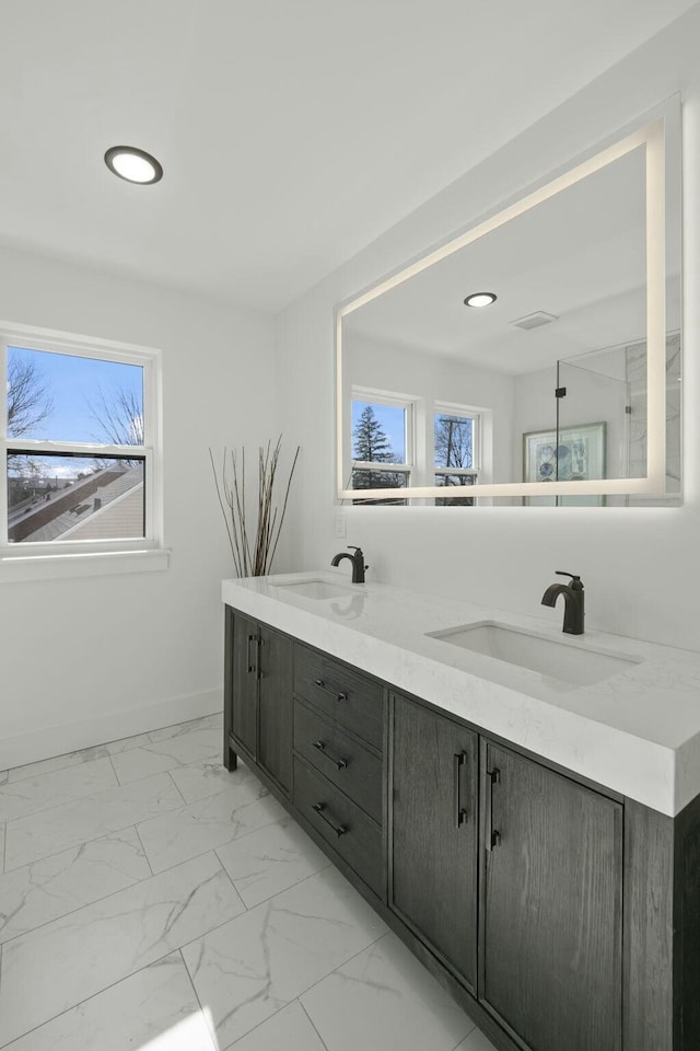 bathroom featuring vanity and plenty of natural light