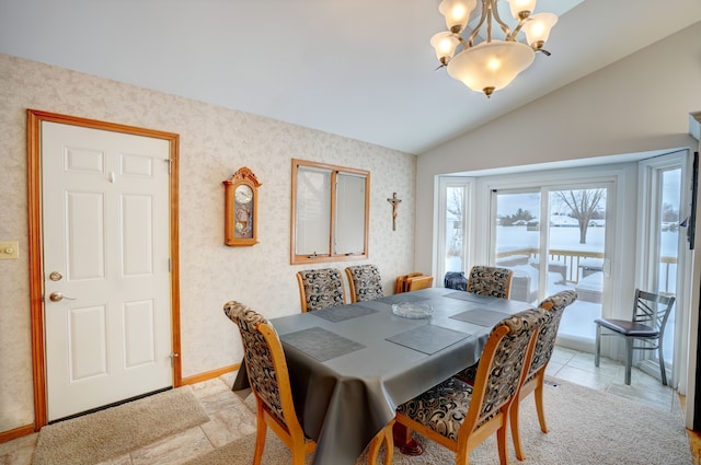 tiled dining room featuring a notable chandelier and vaulted ceiling