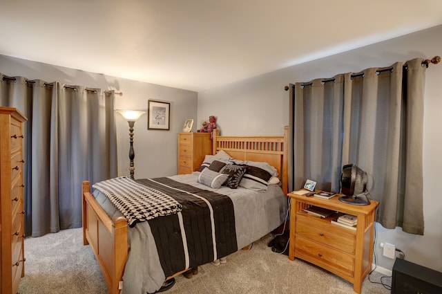 bedroom featuring light colored carpet