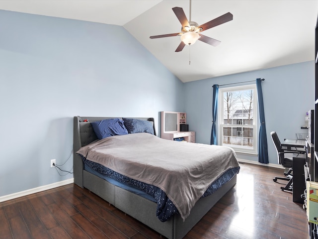 bedroom with lofted ceiling, dark wood finished floors, a ceiling fan, and baseboards