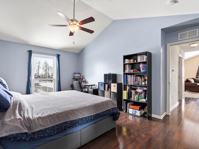 bedroom with dark wood finished floors, lofted ceiling, visible vents, a ceiling fan, and baseboards