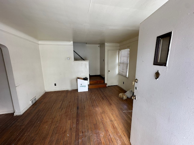 unfurnished living room featuring hardwood / wood-style flooring