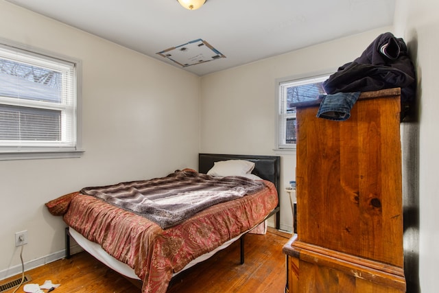 bedroom with hardwood / wood-style floors