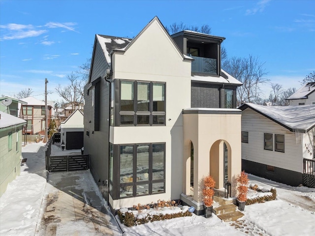 contemporary house featuring a residential view and stucco siding