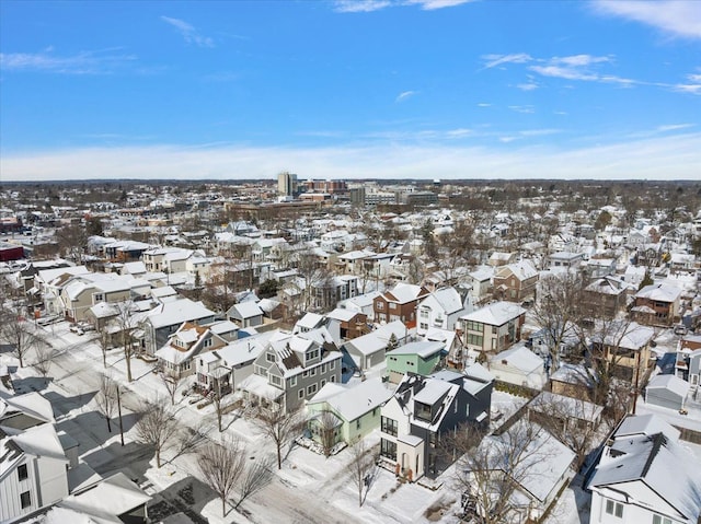 snowy aerial view featuring a residential view