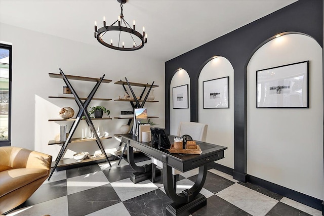 office space with baseboards and an inviting chandelier