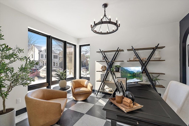 home office featuring a chandelier and arched walkways