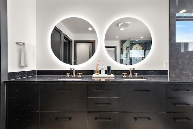 full bathroom featuring a sink and double vanity