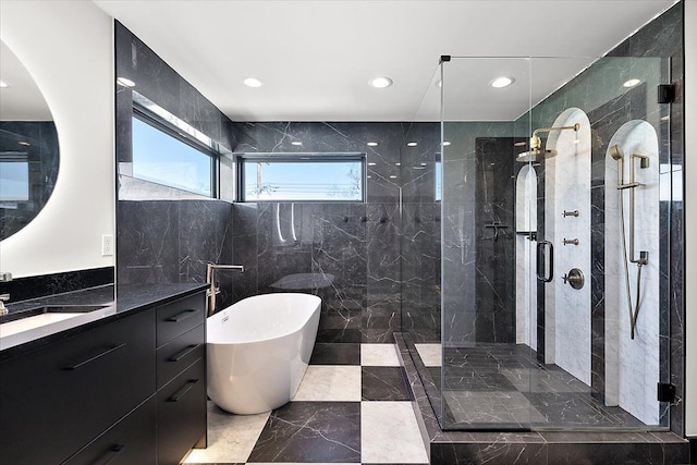 full bathroom featuring recessed lighting, a soaking tub, a shower stall, and vanity