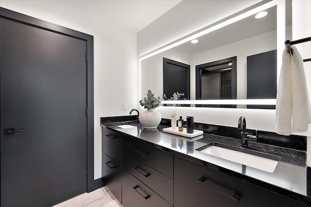 full bath featuring recessed lighting, a sink, and double vanity