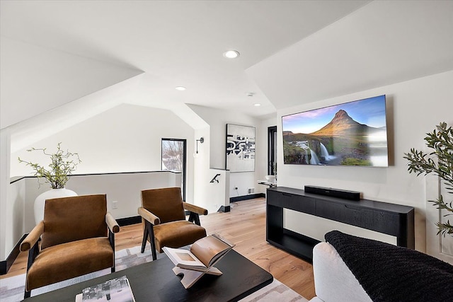 interior space featuring lofted ceiling, light wood-style flooring, and recessed lighting