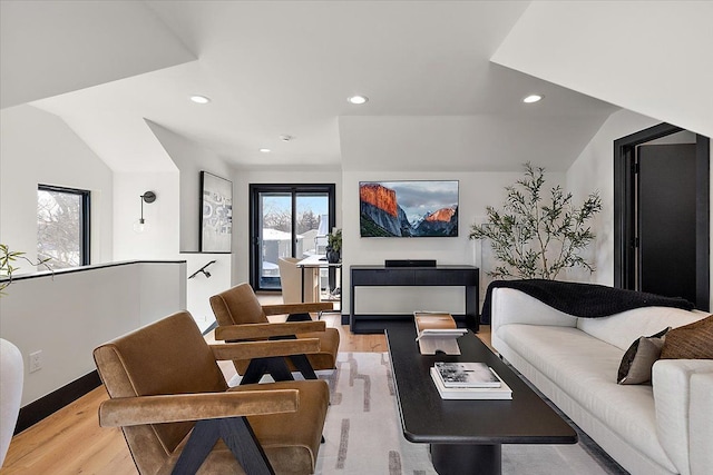 living room with light wood-style floors, a wealth of natural light, and recessed lighting