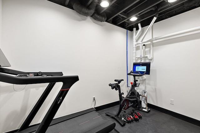 exercise room with baseboards