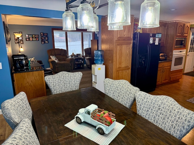 dining space featuring dark hardwood / wood-style floors