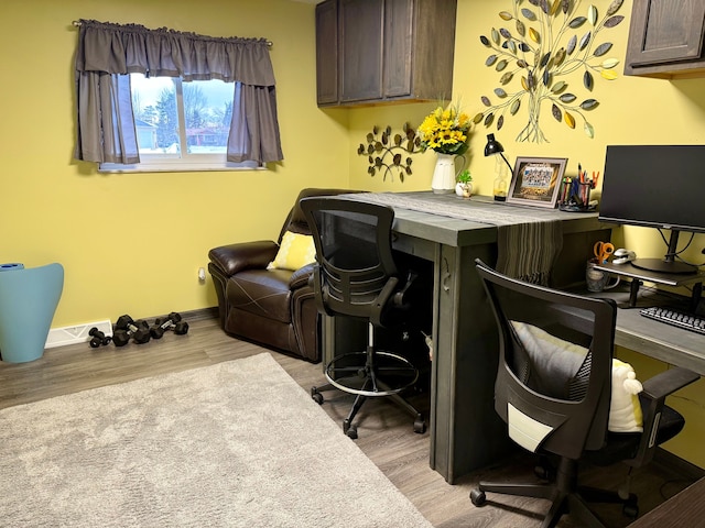 office with light hardwood / wood-style floors