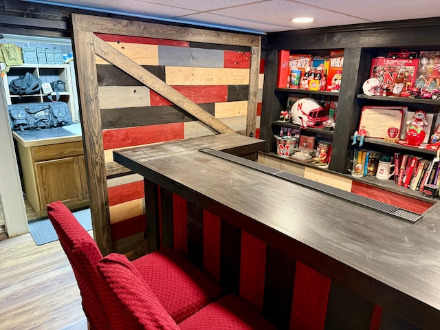 bar with wood-type flooring