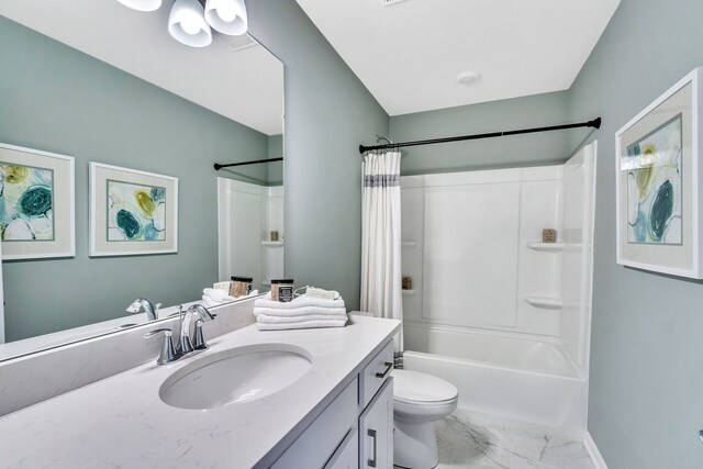 bathroom featuring toilet, shower / bath combo, marble finish floor, and vanity