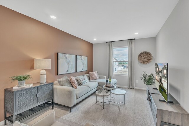 carpeted living room with baseboards and recessed lighting