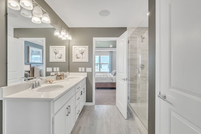 bathroom featuring walk in shower and vanity