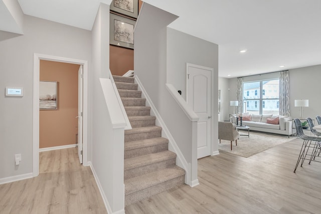 stairway featuring hardwood / wood-style floors