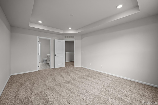 2302 Mill Ln, Saline, MI 48176 - unfurnished bedroom featuring a tray ceiling, baseboards, recessed lighting, carpet floors, and a spacious closet