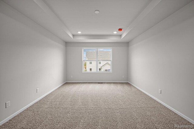 2302 Mill Ln, Saline, MI 48176 - unfurnished room with a raised ceiling, baseboards, carpet flooring, and recessed lighting