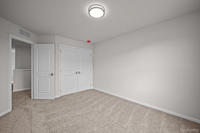 2302 Mill Ln, Saline, MI 48176 - unfurnished bedroom featuring carpet floors, baseboards, and a closet