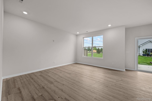 2302 Mill Ln, Saline, MI 48176 - unfurnished room with wood finished floors, baseboards, and recessed lighting