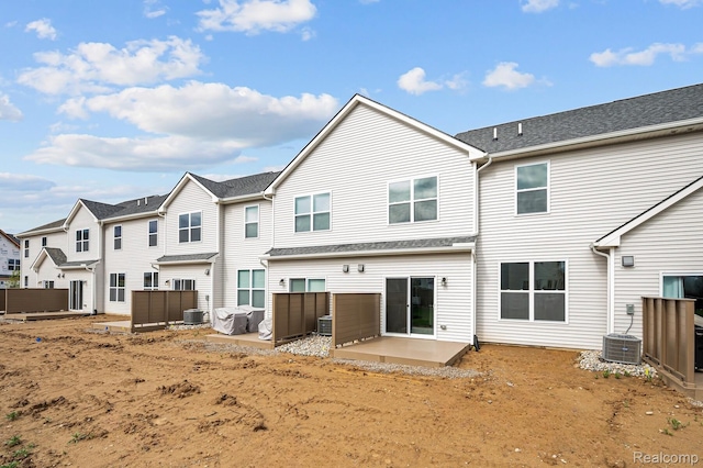 2302 Mill Ln, Saline, MI 48176 - rear view of property featuring central AC, a residential view, and a patio