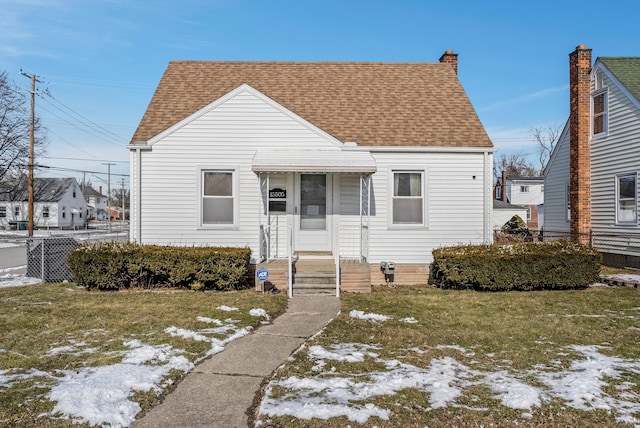 bungalow-style house with a lawn