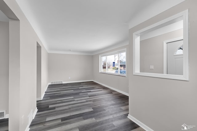 unfurnished room featuring dark hardwood / wood-style floors