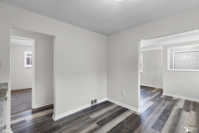 empty room featuring dark hardwood / wood-style floors