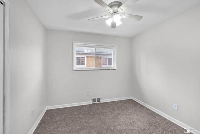 spare room with carpet flooring and ceiling fan