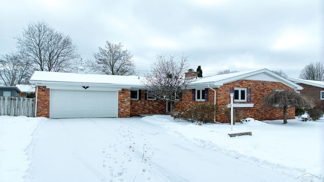 ranch-style house featuring a garage