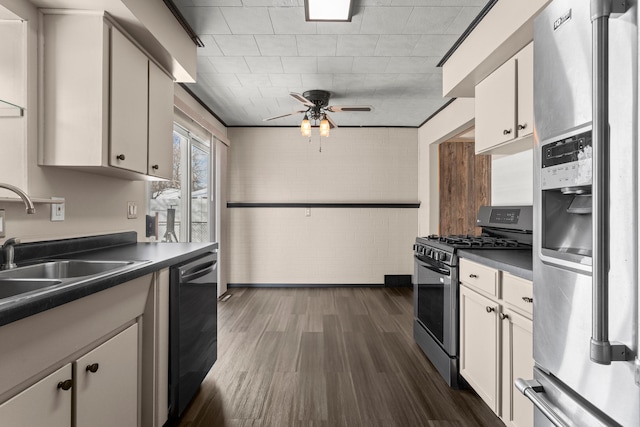 kitchen with stainless steel appliances, dark wood-type flooring, sink, and white cabinets